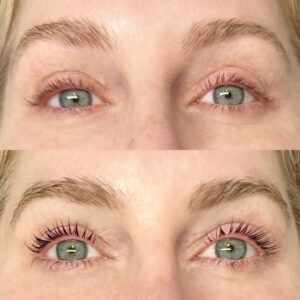 A woman with long eyelashes and green eyes.