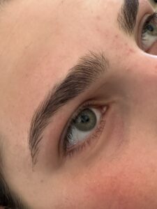 A close up of the eyes and brows of a person