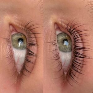 A woman with green eyes and long eyelashes.