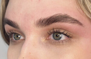 A close up of the eyes with green eyes
