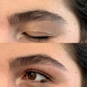 A woman with brown eyes and long lashes.