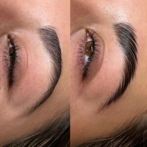 A woman with long, thick eyelashes and brown brows.