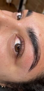 A close up of the eye with long eyelashes