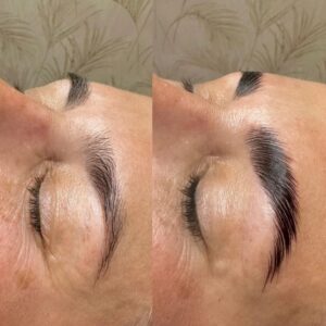 A woman with her eyes closed and the brows are trimmed.