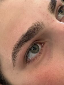 A close up of the eyes and brows of a person