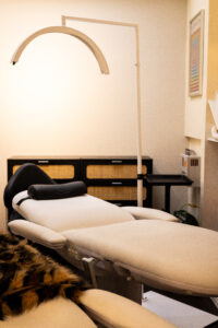 A room with two beds and a table