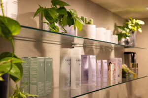 A shelf with many different types of hair products.