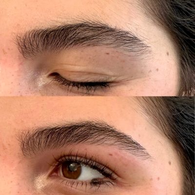 A woman with brown eyes and long lashes.